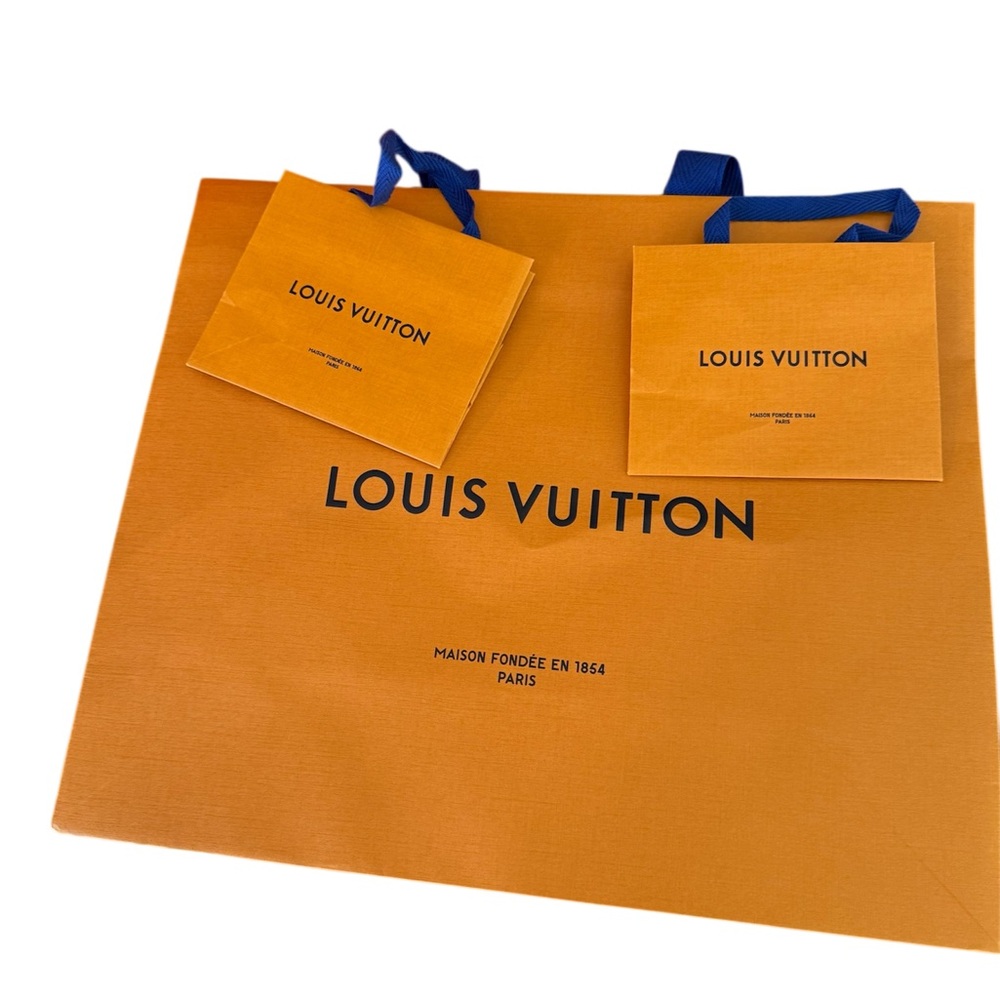 Three Louis Vuitton Shopping Bags with Blue Handles